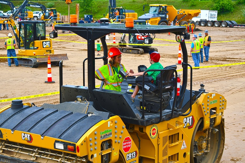 Kid and adult in Cat machine