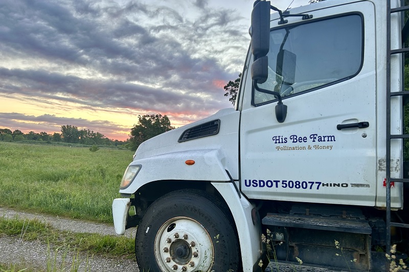 photo of semi truck at sunset